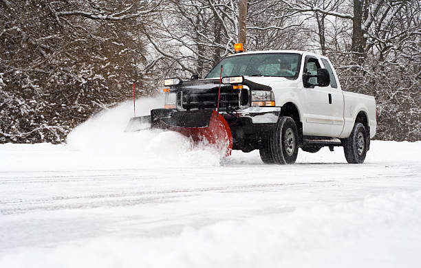 Snowplow clearing a commercial lot